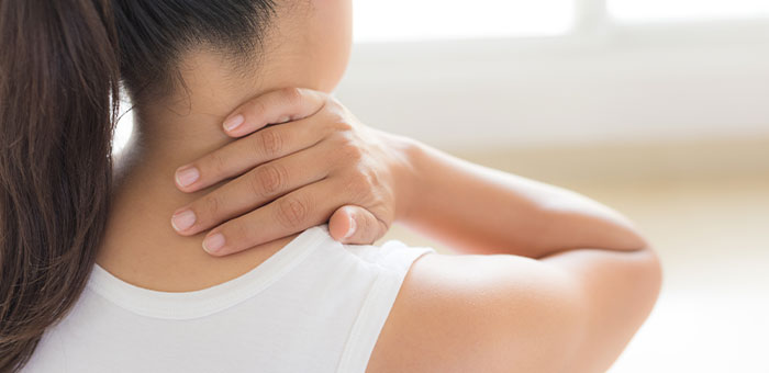patient suffering from neck pain needing a chiropractor in Valley Village